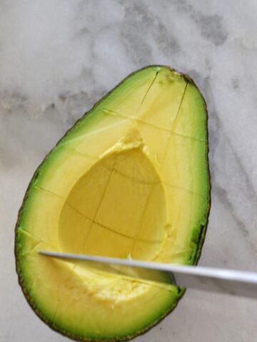 scoring avocado in peel