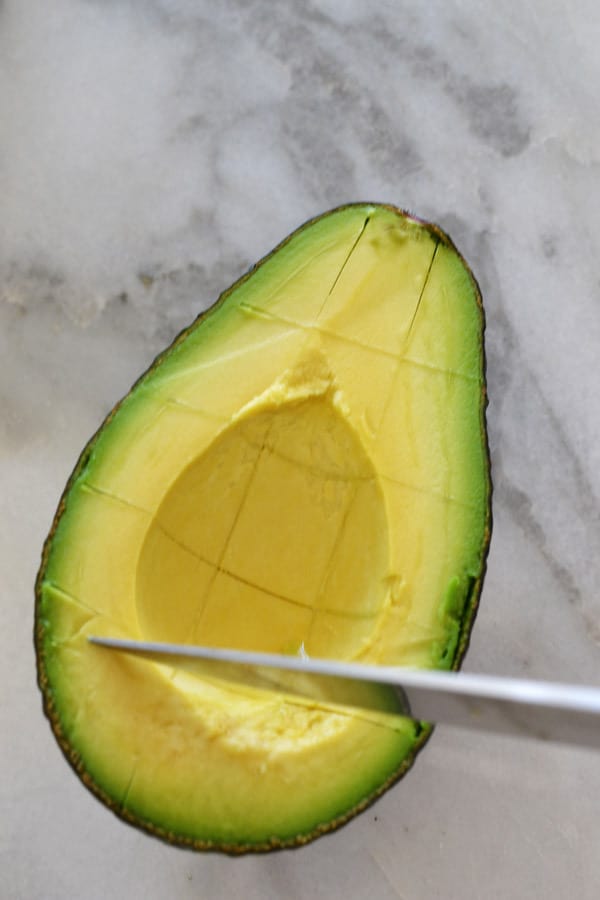 scoring avocado in peel
