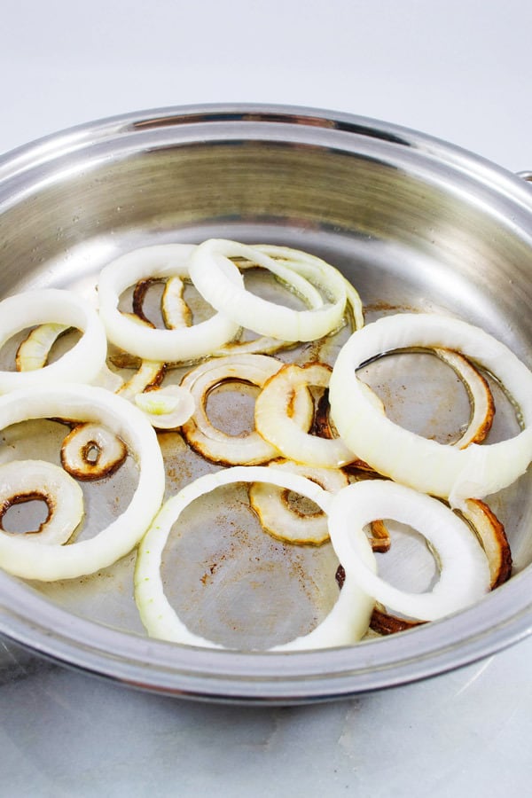 onions being cooked in clarified butter