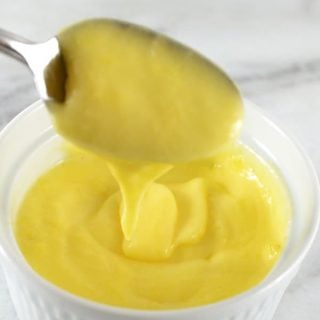 bowl and spoon of healthy hollandaise sauce