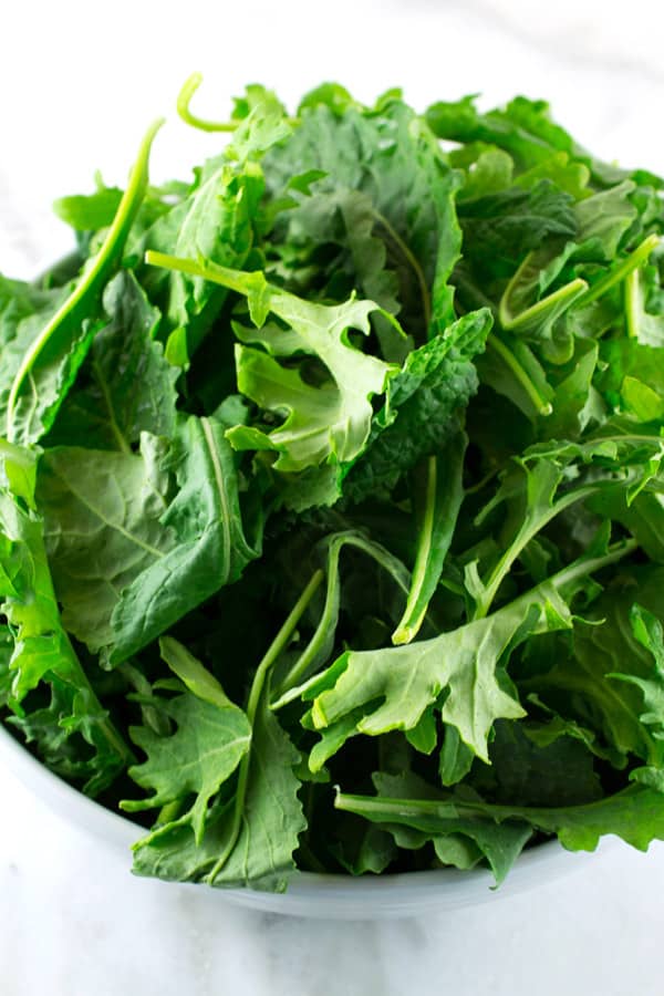 bowl of baby kale leaves