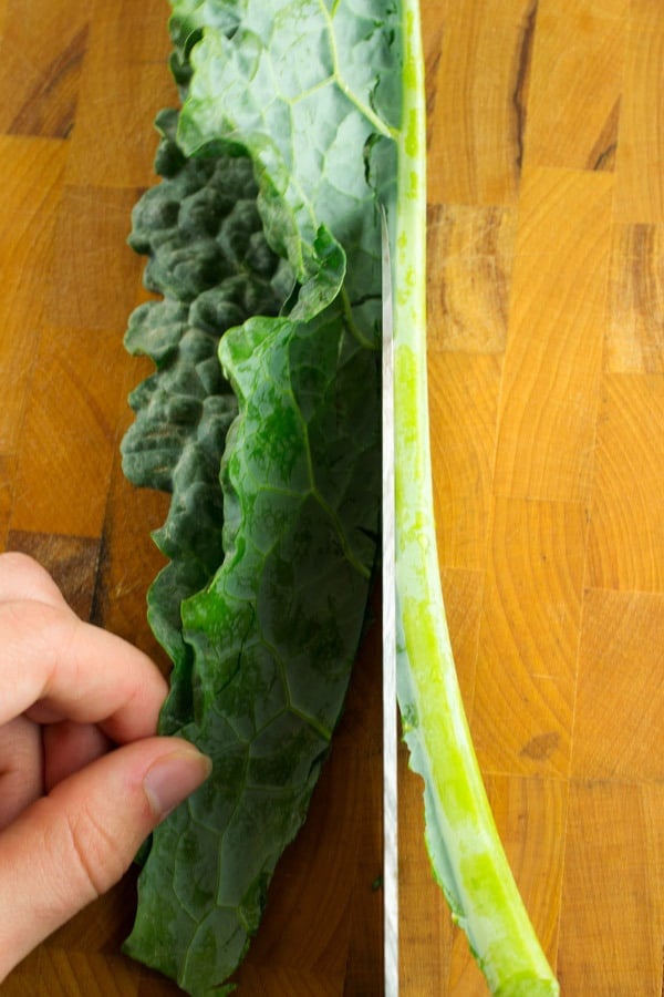 cutting the stalk off the kale