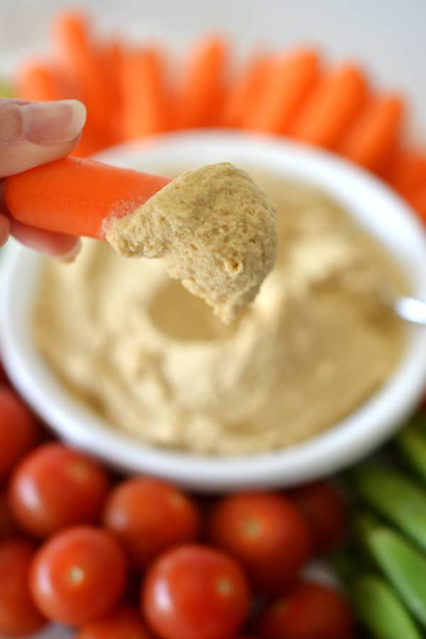 hummus on a carrot stick