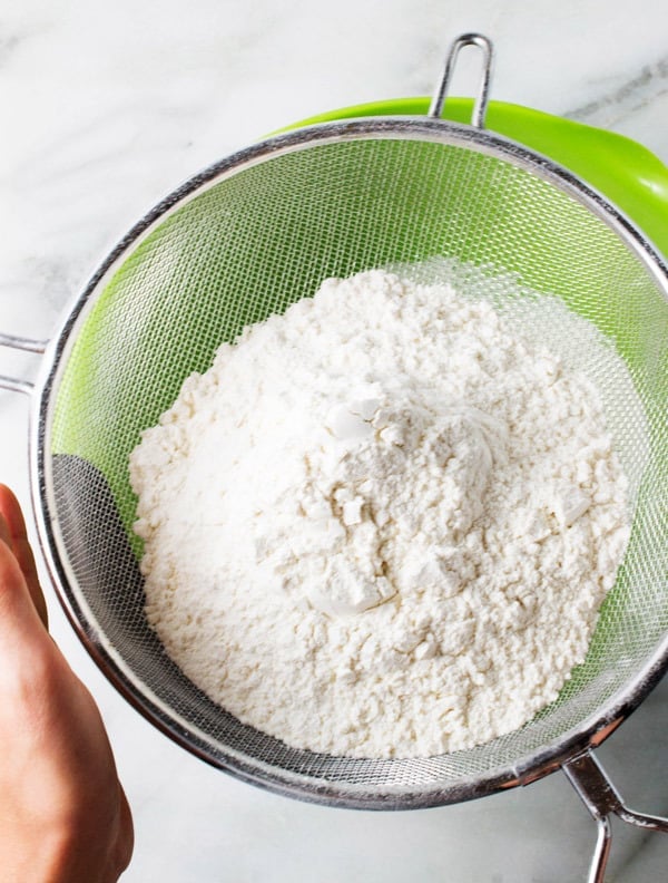 sifting flour for snickerdoodle cookies