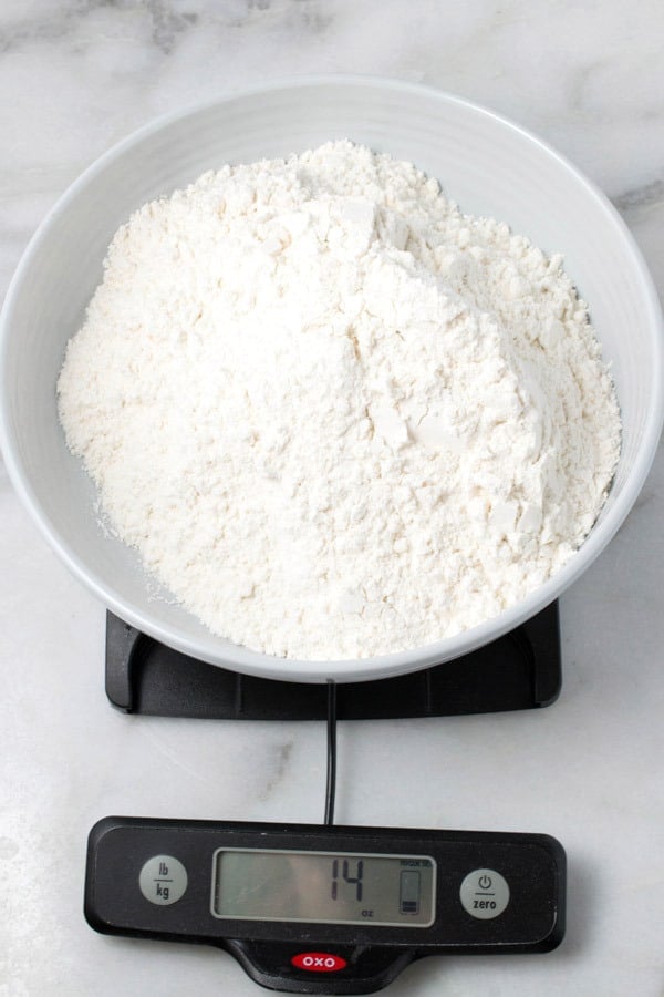 weighing flour for snickerdoodle cookies