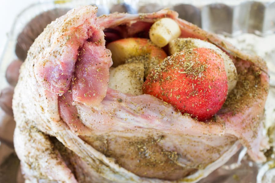 raw turkey with rubbed seasonings