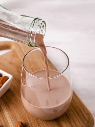 pouring vegan chocolate milk