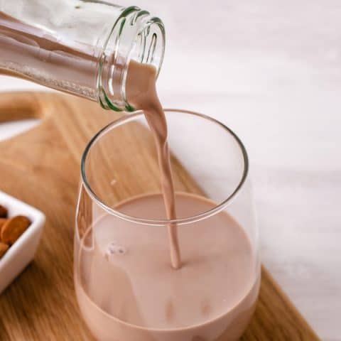 pouring vegan chocolate milk