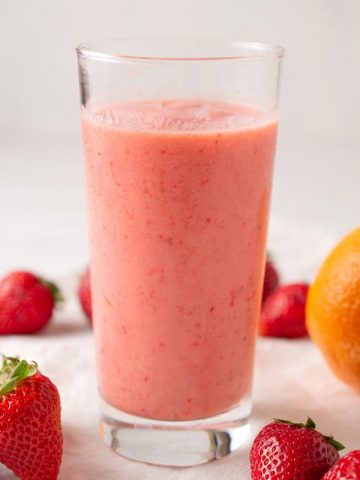 glass of cara cara strawberry smoothie with yogurt