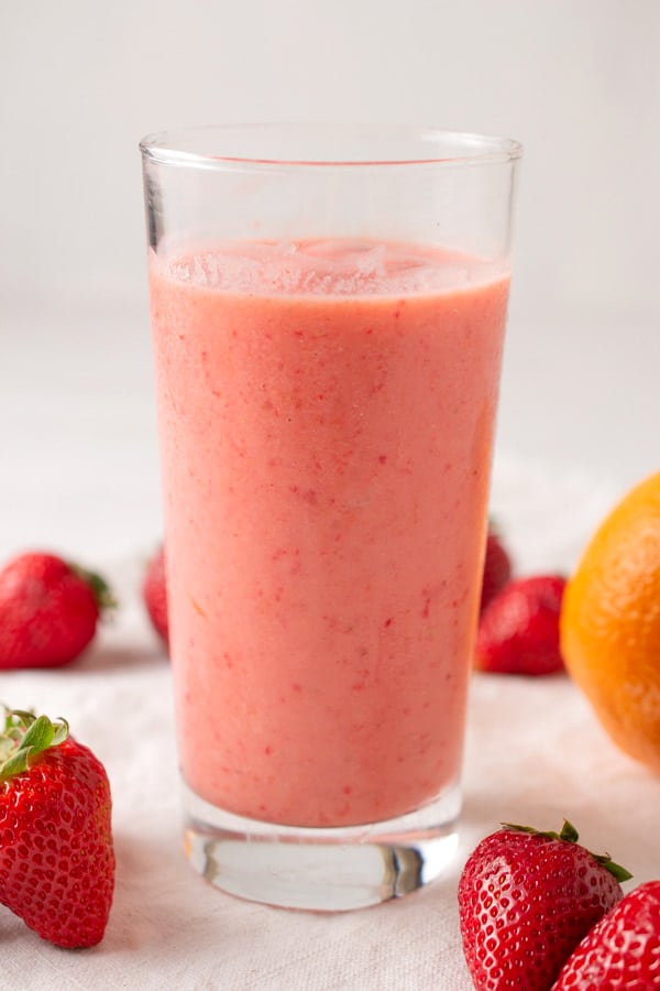 glass of cara cara strawberry smoothie with yogurt