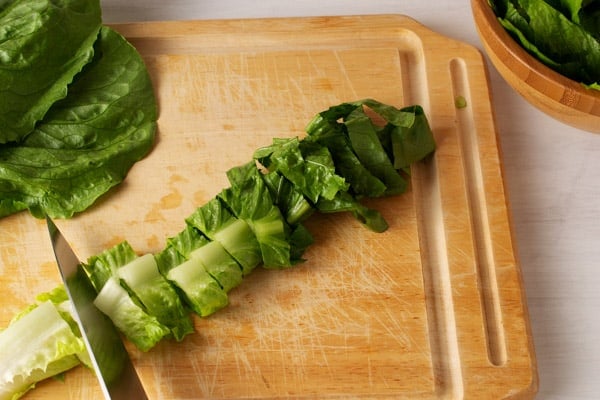 cutting romaine lettuce into ribbons