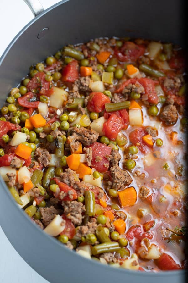 stock pot of vegetable soup with ground beef