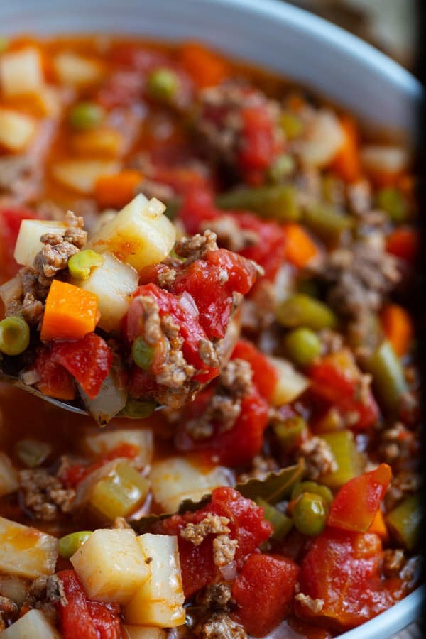 spoon of vegetable soup with ground beef