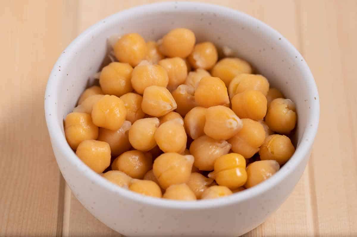 Bowl of cooked chickpeas that were soaked in salt water.