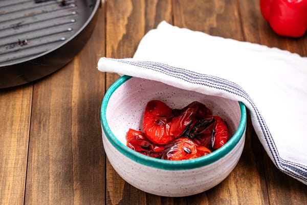 roasted peppers steaming in a bowl
