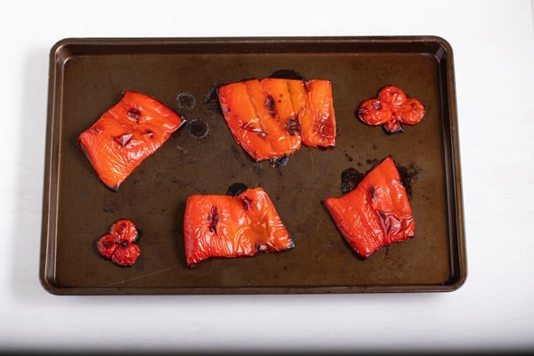 roasted red peppers on a baking sheet