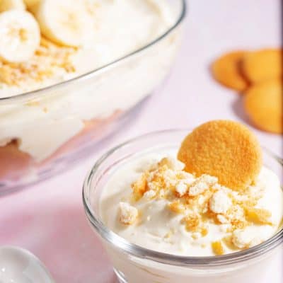 small bowl of banana pudding next to larger serving bowl of banana pudding