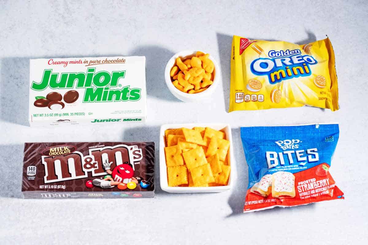 Movie snacks for kids with braces like crackers, chocolate candies, and mini Oreos.