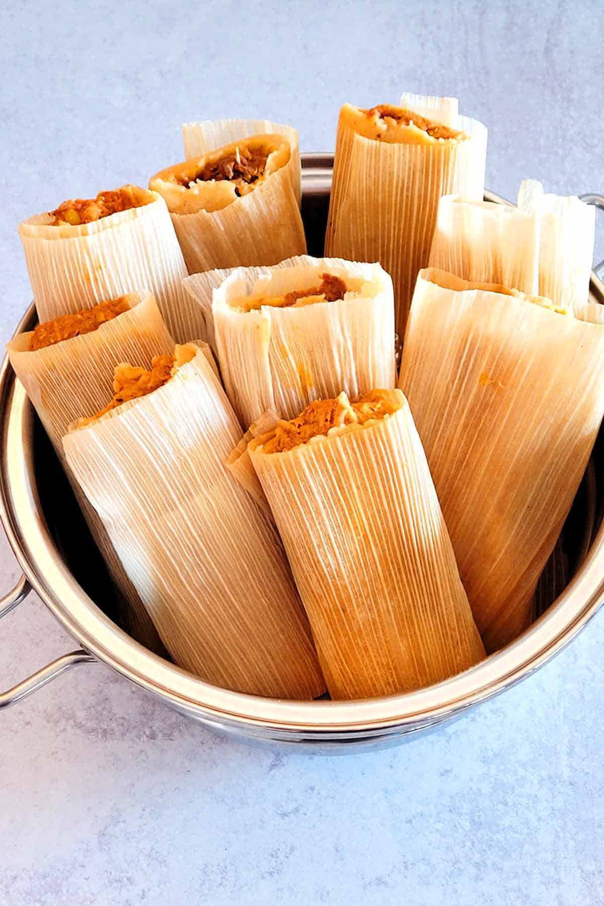 Cooking frozen tamales in a steamer.