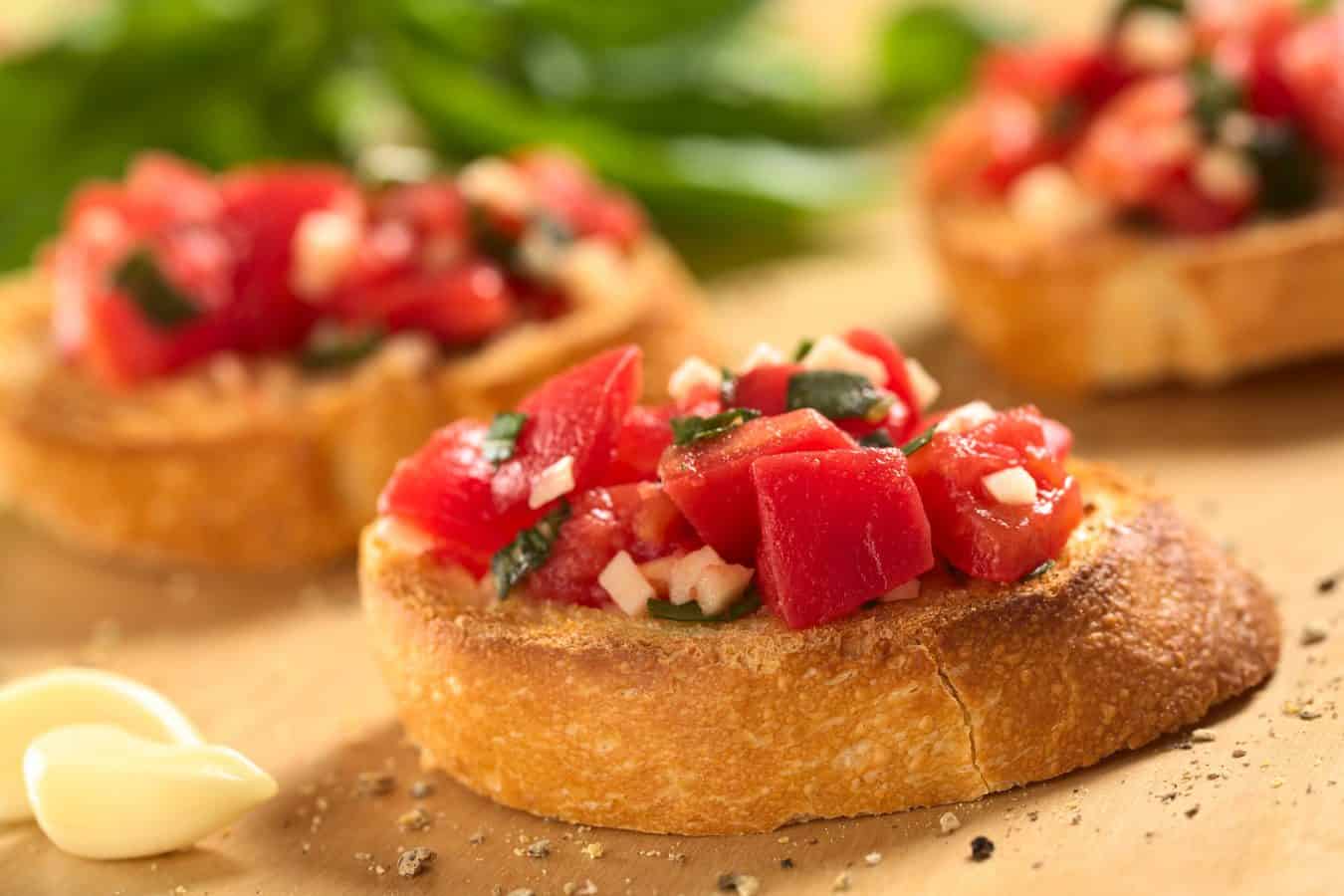 Bruschetta with diced tomatoes, basil, and mozzarella.