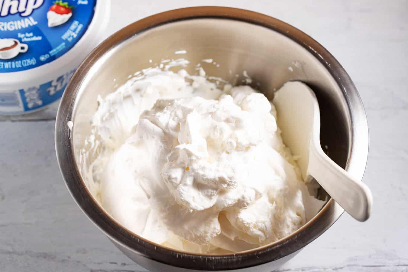 bowl with Cool Whip folded in to sour cream