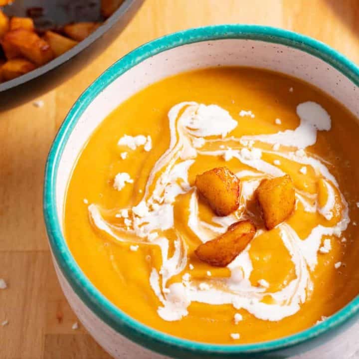 bowl of butternut squash soup with roasted apples