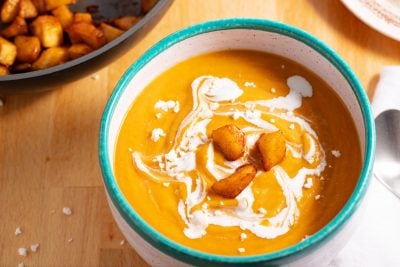 bowl of butternut squash soup with roasted apples