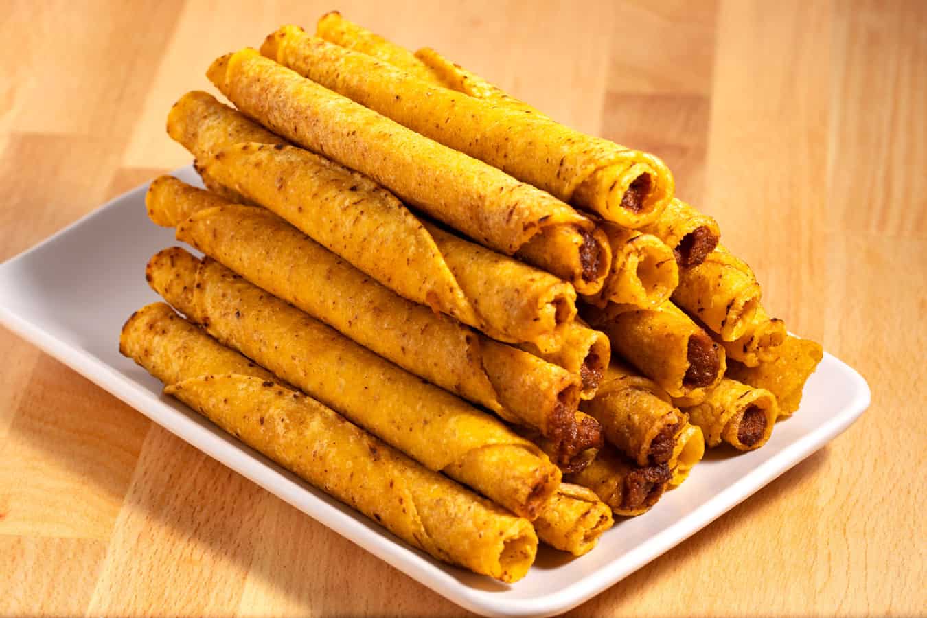Taquito stack on a plate.