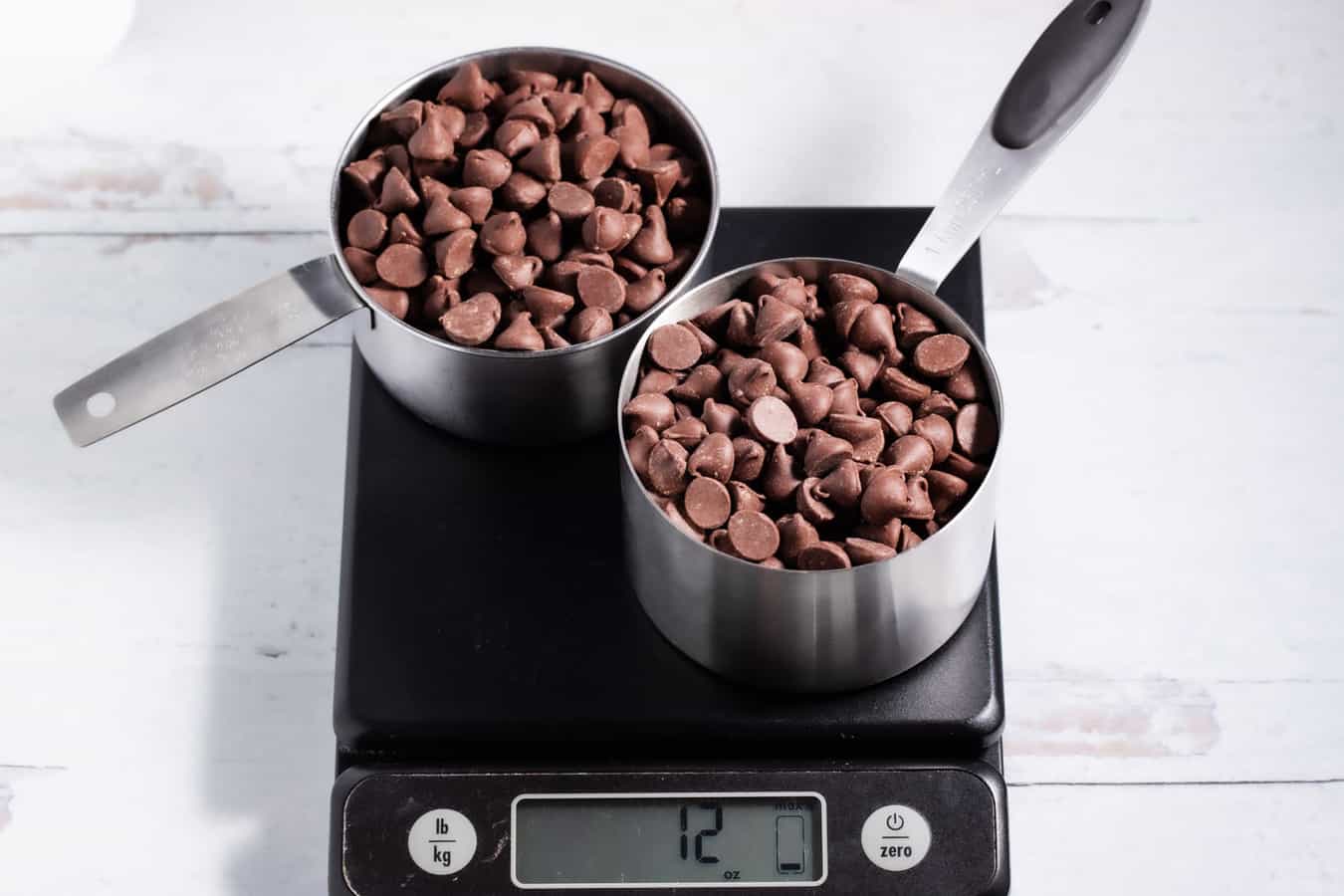 2 cups of chocolate chips on a kitchen scale showing 12 oz