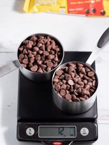2 cups of chocolate chips on a kitchen scale with chocolate chip bag