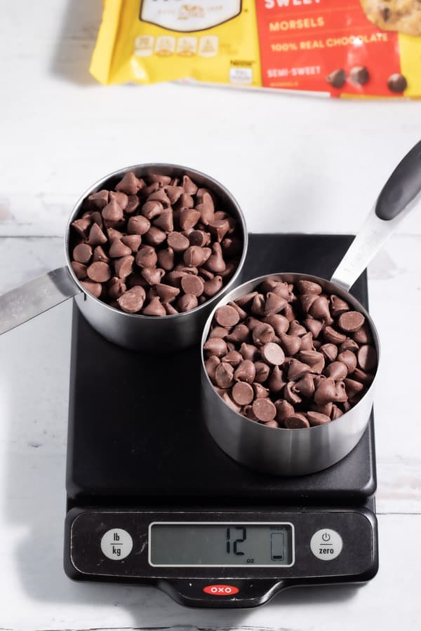 2 cups of chocolate chips on a kitchen scale with chocolate chip bag