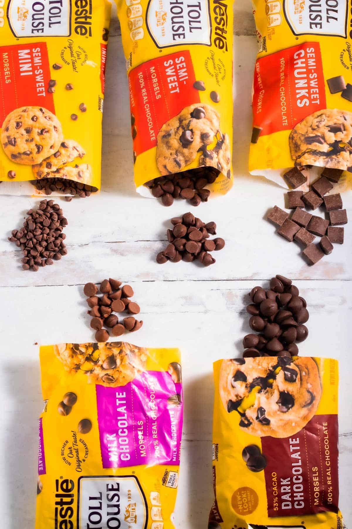 Several bags of chocolate chips of various sizes.