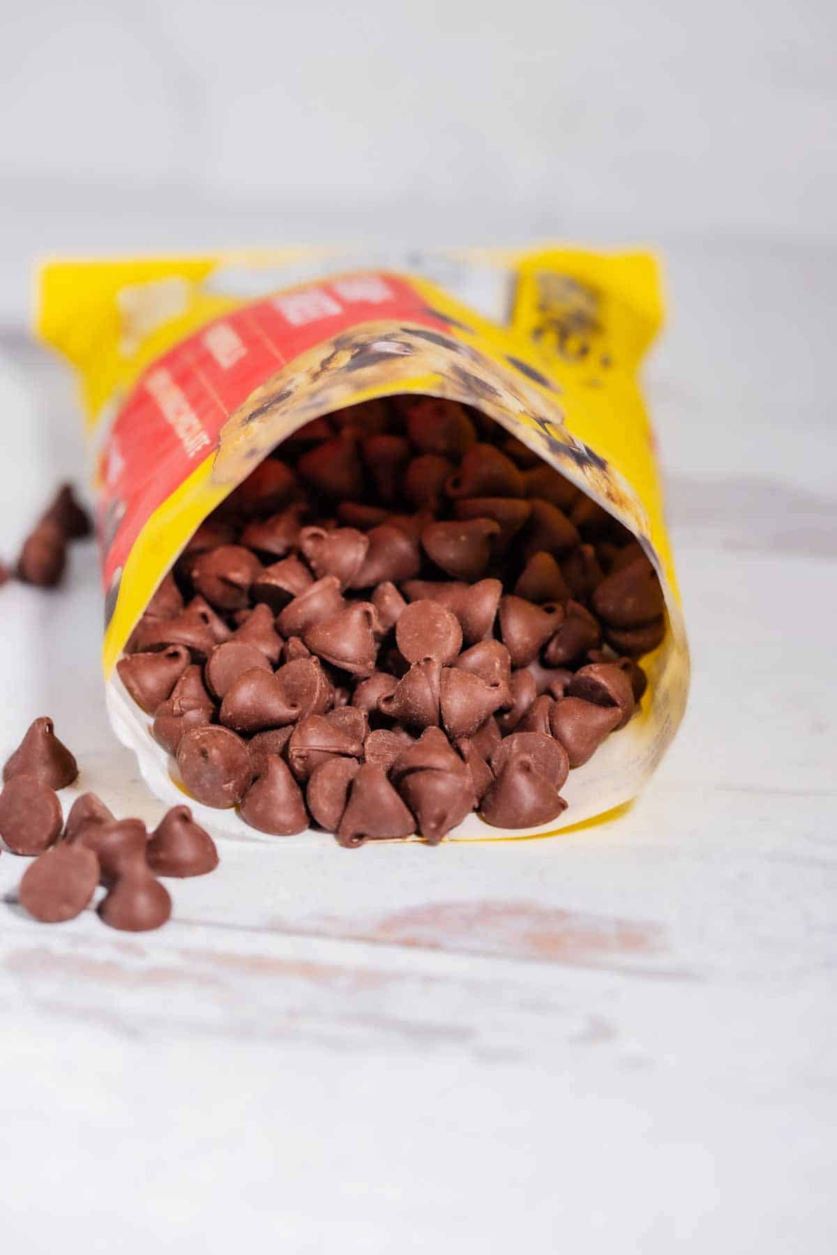 Open bag of Nestle Toll House chocolate chips.