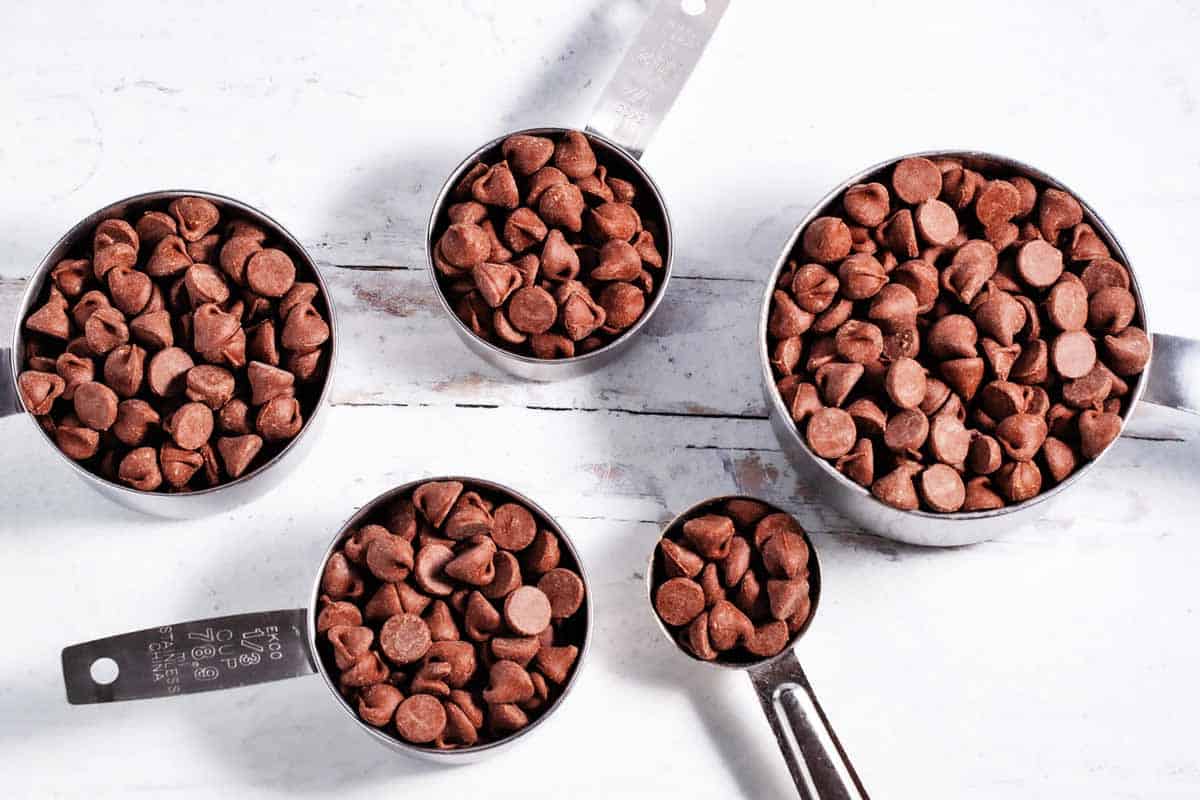 1 cup, ½ cup, ⅓ cup, ¼ cup, and 1 tablespoon filled with chocolate chip morsels