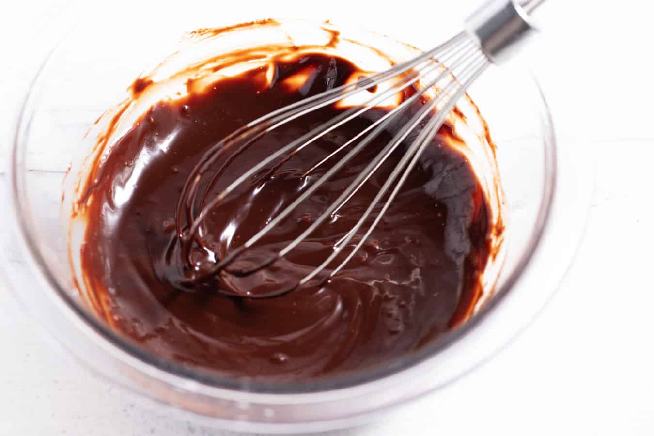 Wire whisk mixing seized chocolate.