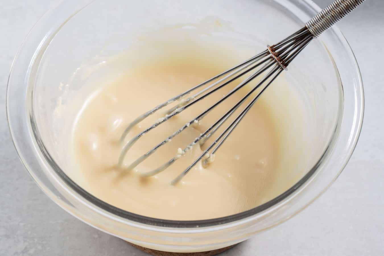 fixing seized white chocolate by whisking in warm water