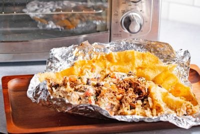 unrolled burrito ready to go in the toaster oven to reheat