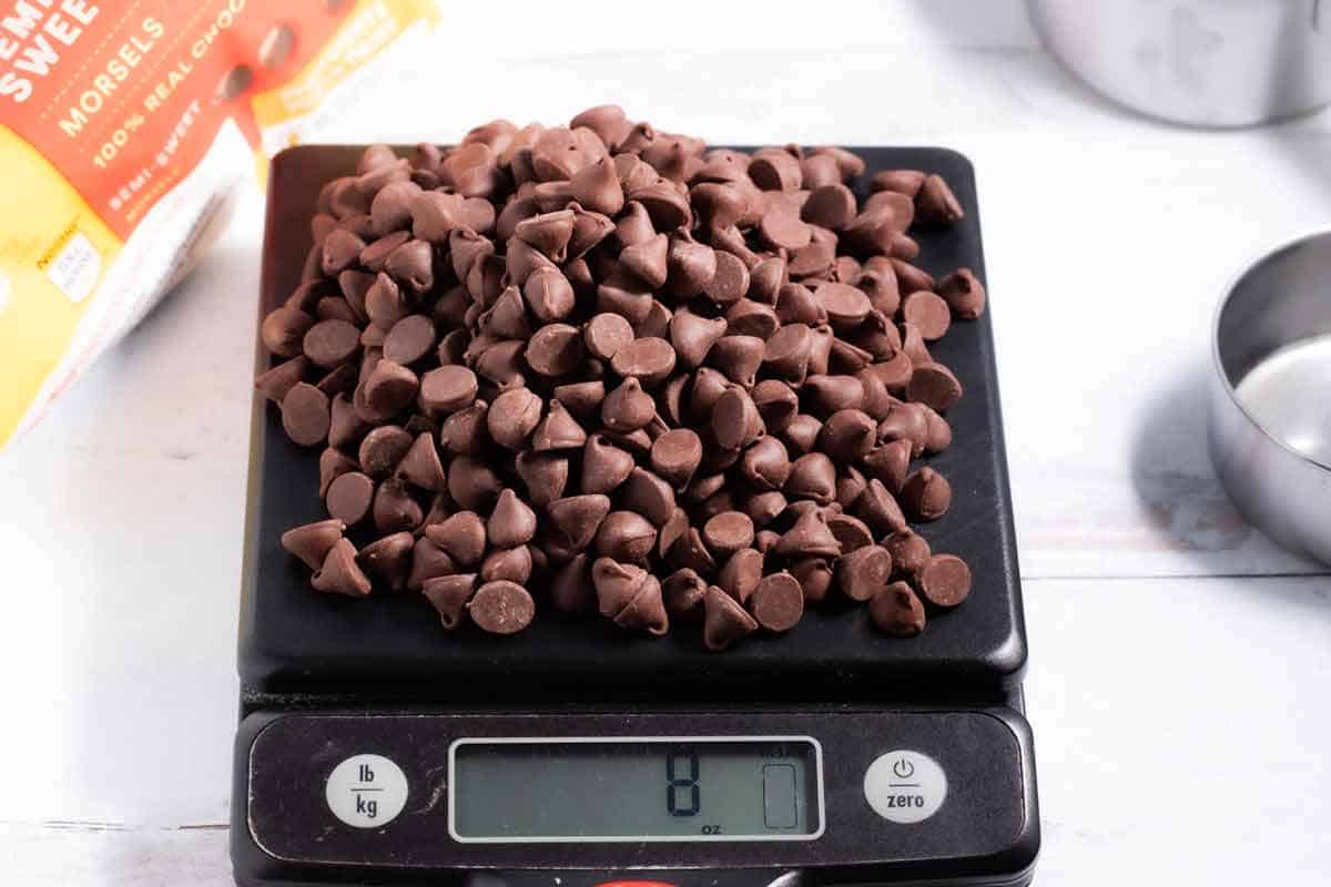 Chocolate chips on a kitchen scale.