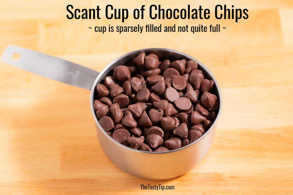 Scant cup of chocolate chips on the counter.