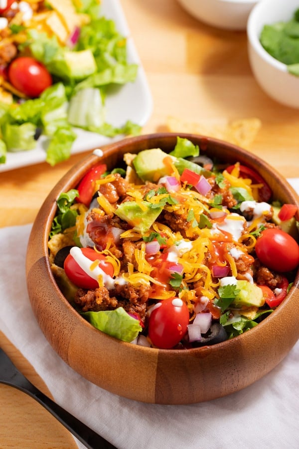 bowl and plate of taco salad with catalina dressing