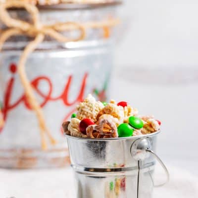 Christmas chex mix in a serving pail