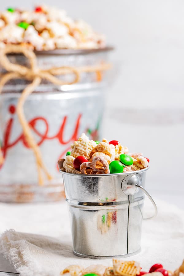 Christmas chex mix in a serving pail