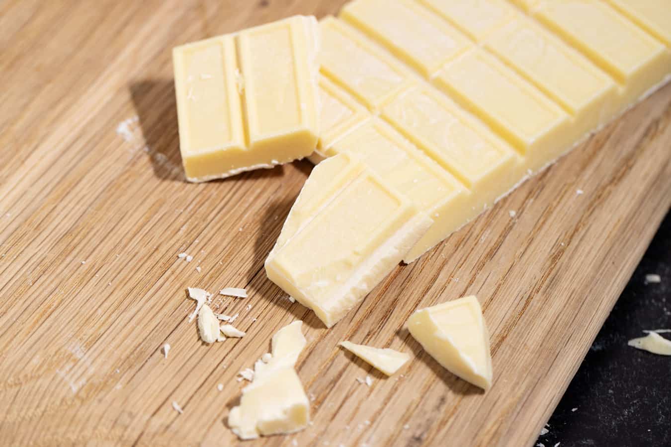 White chocolate bar broken in pieces.