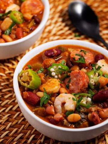 bowl of spicy Cajun bean soup with sausage, shrimp, and okra