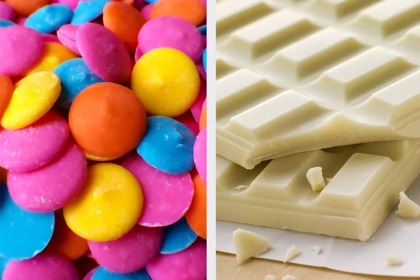 Colorful candy melts next to white chocolate.