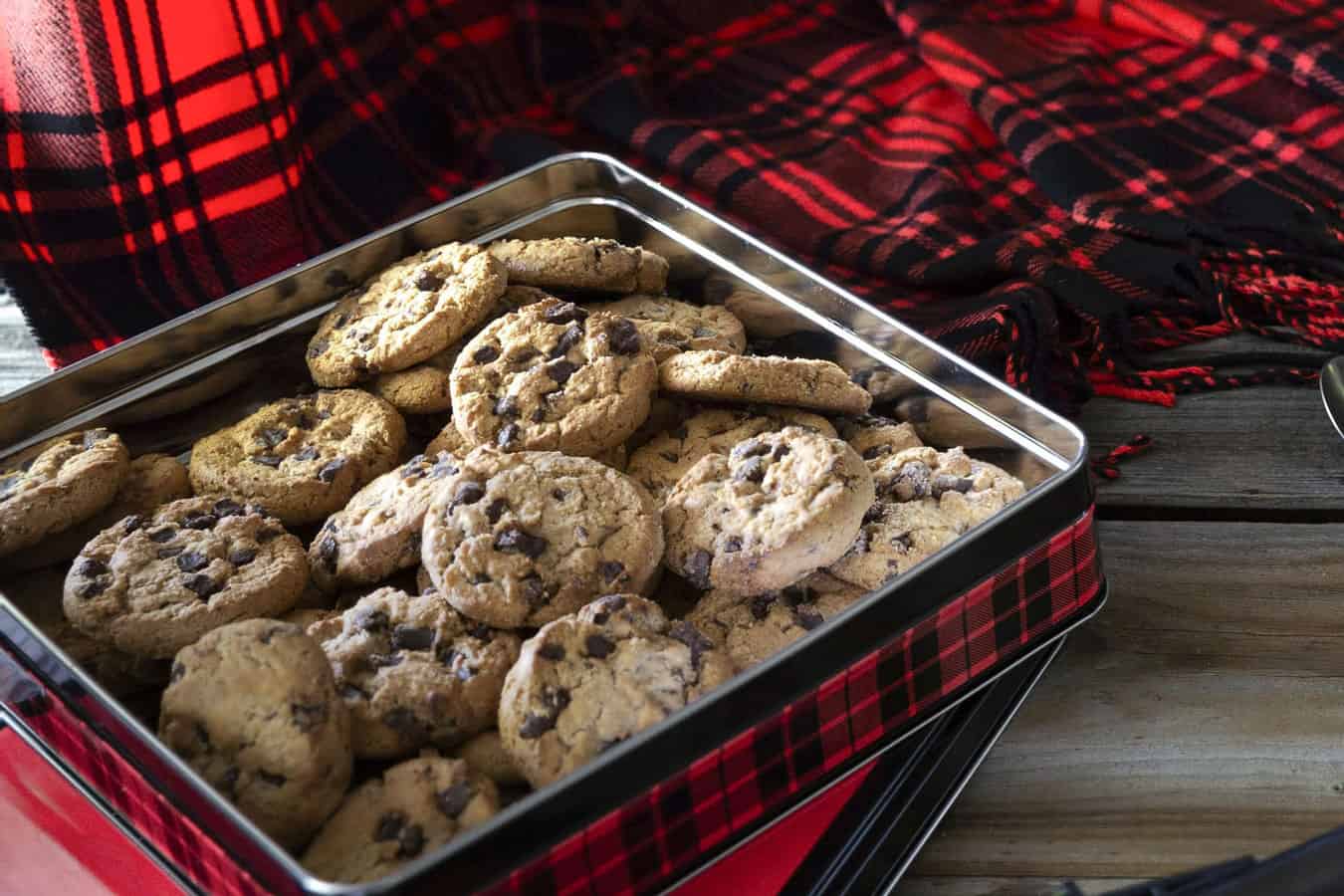 Storing chocolate chip cookies in a cookie tin.