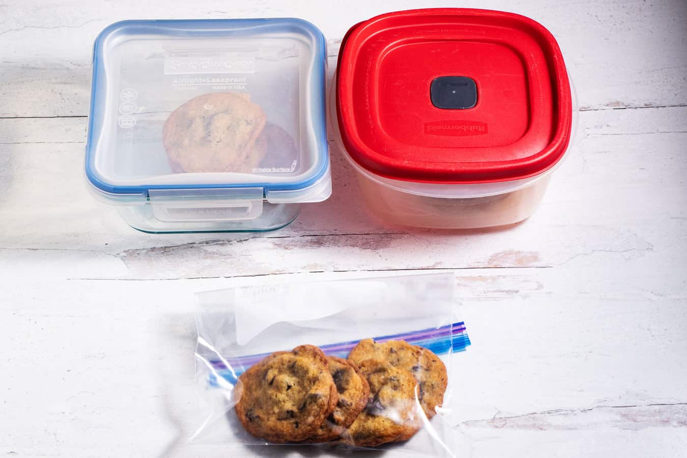 Glass, plastic, and zip top storage containers for chocolate chip cookies.