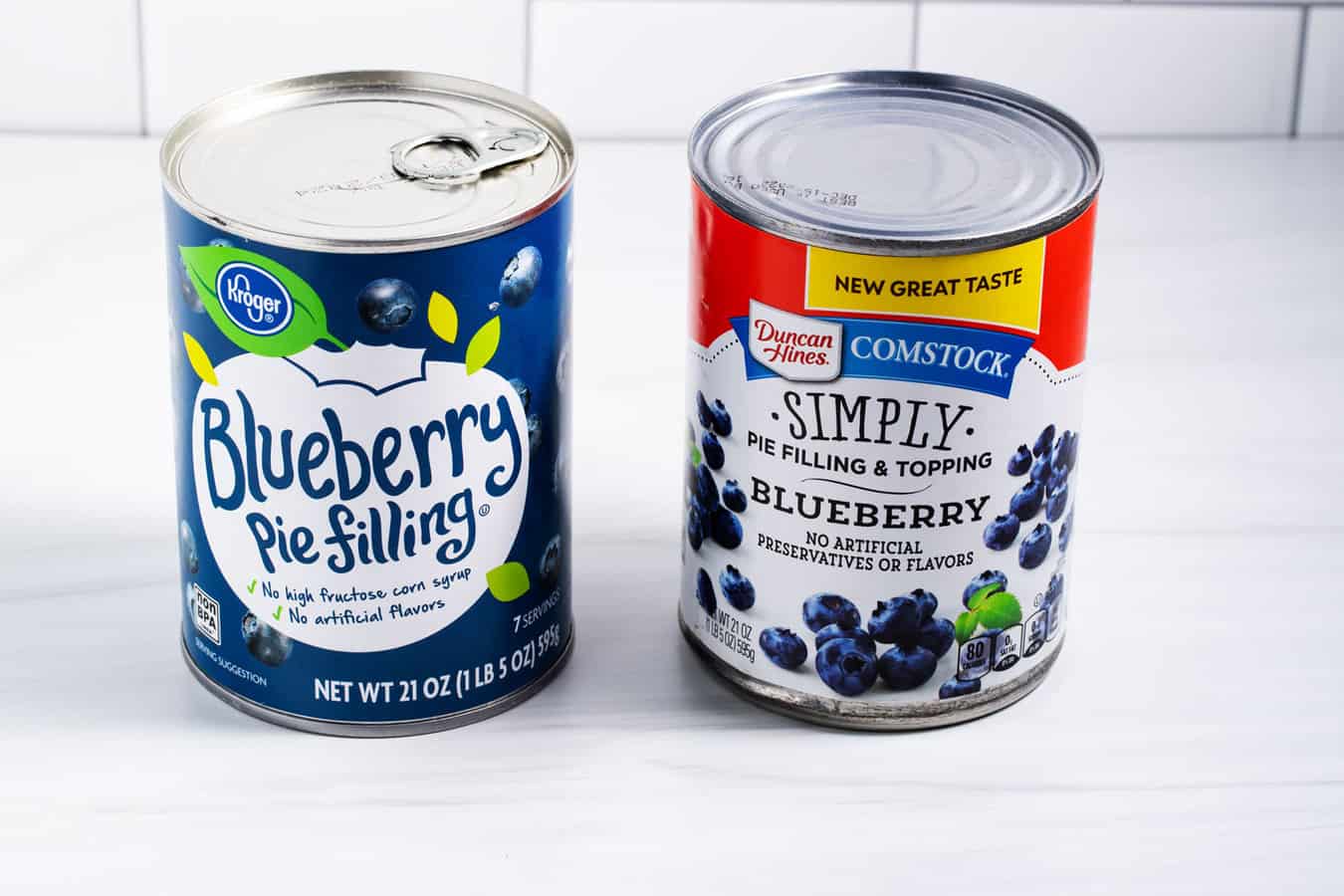 Cans of blueberry pie filling.