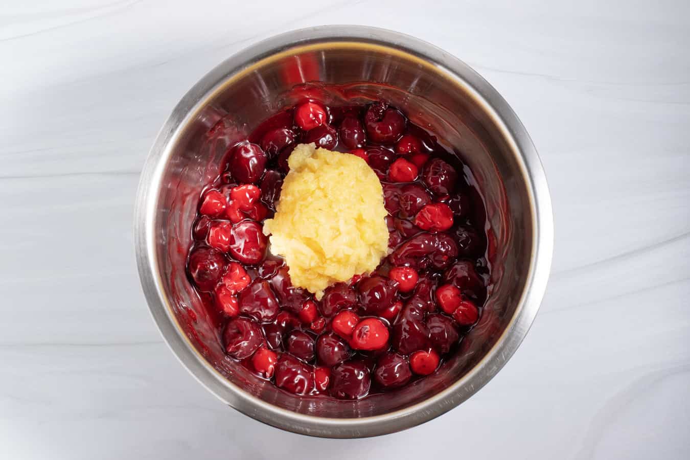 cherries and crushed pineapple in a bowl