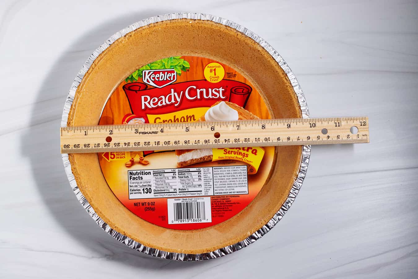 Ruler measuring 9 oz premade graham cracker crust.